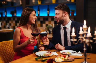 Couple enjoying red wine on Valentine’s Day